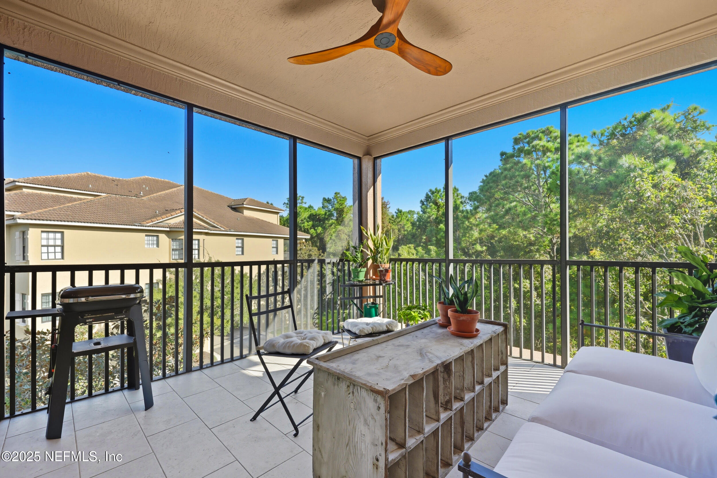 210 Paseo Terraza, Unit 301 St. Augustine, FL 32095 - Photo 32 of 54 a view of a patio with a table chairs and a table