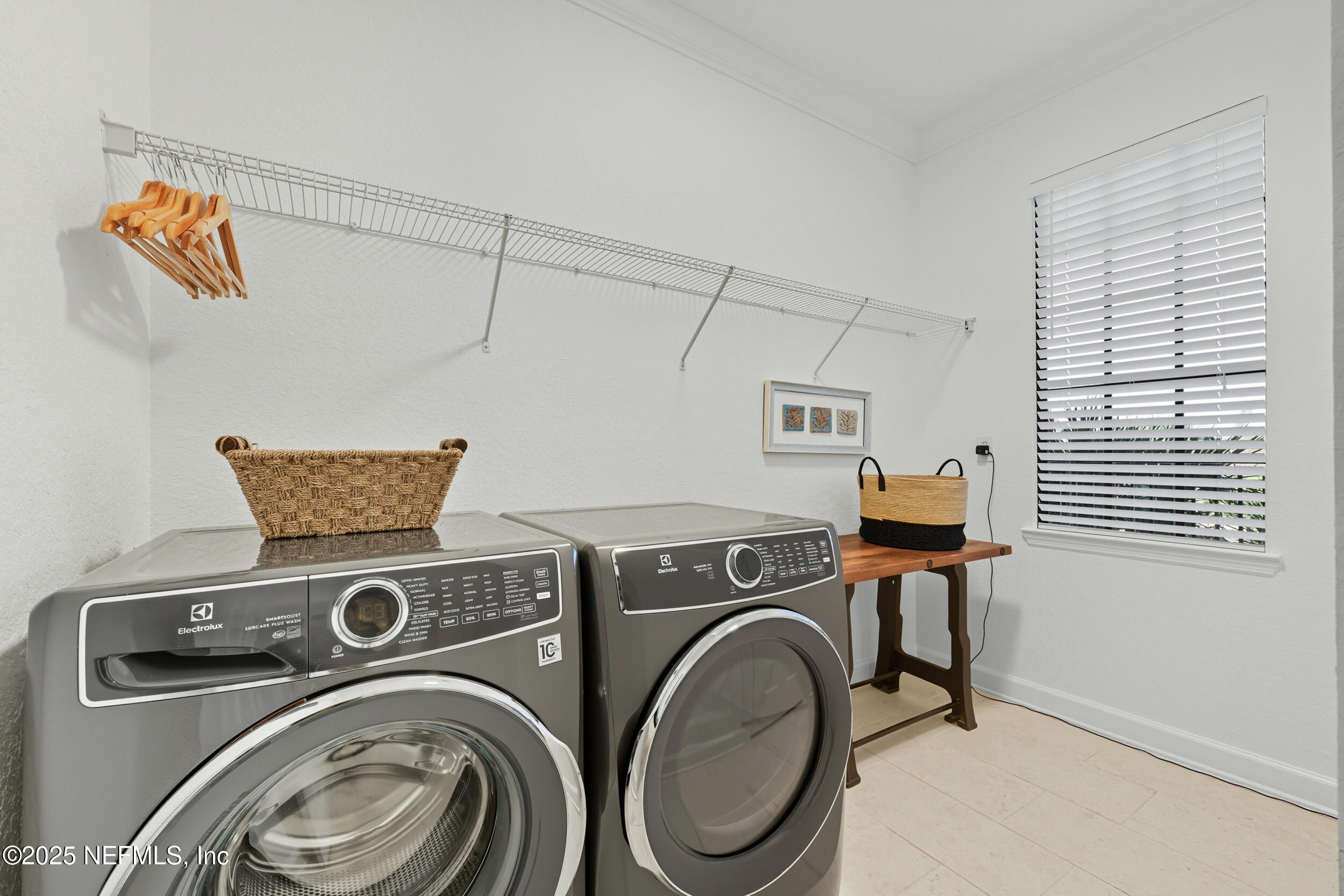 210 Paseo Terraza, Unit 301 St. Augustine, FL 32095 - Photo 35 of 54 a utility room with dryer and washer