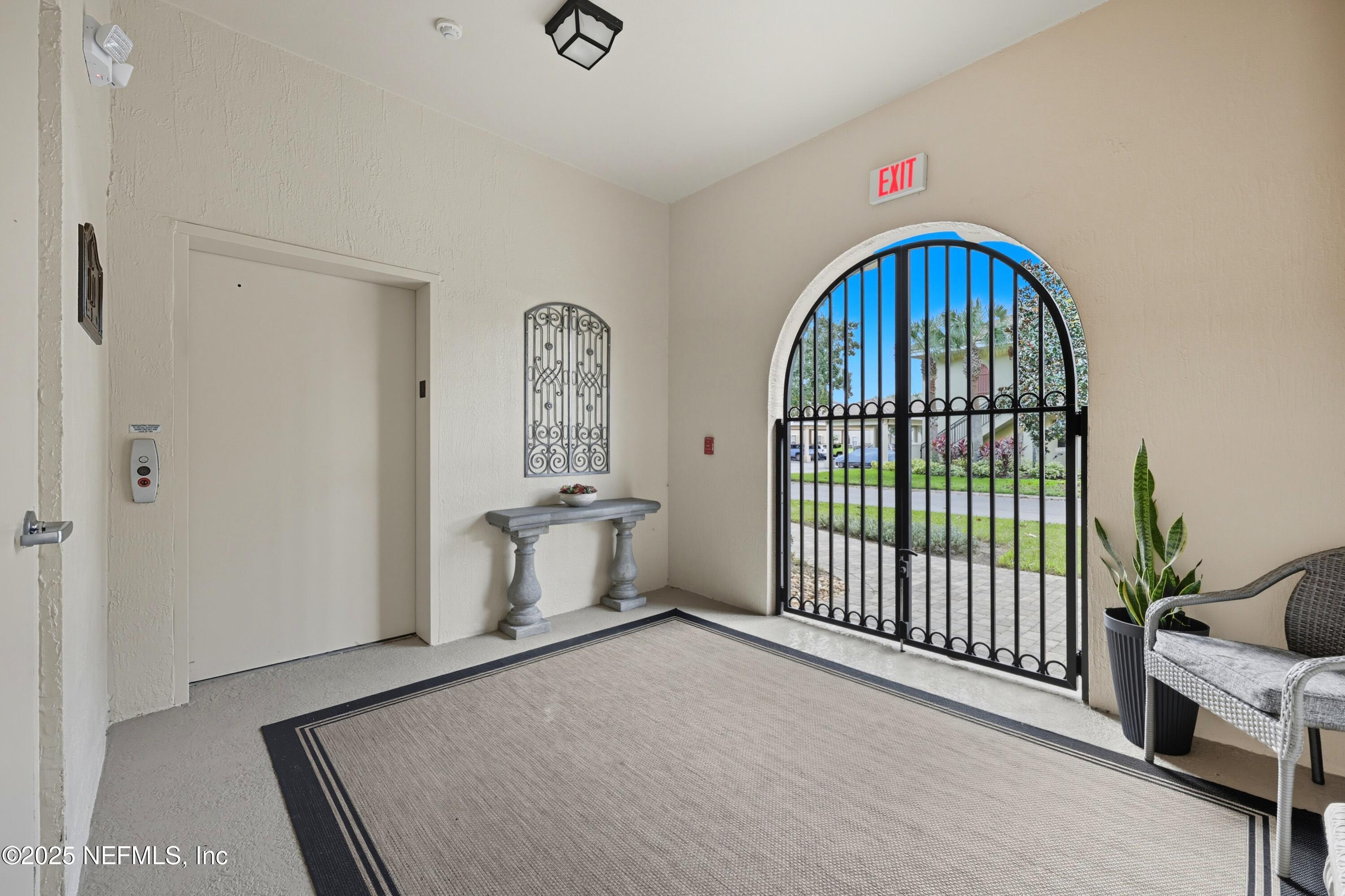 210 Paseo Terraza, Unit 301 St. Augustine, FL 32095 - Photo 5 of 54 a view of an entryway with a rug
