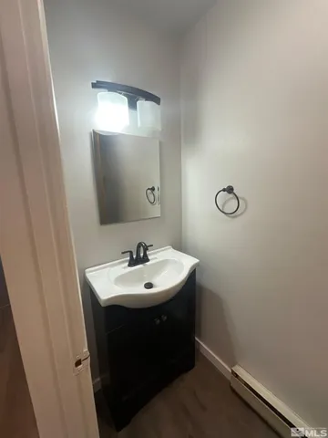 a bathroom with a sink a mirror and vanity