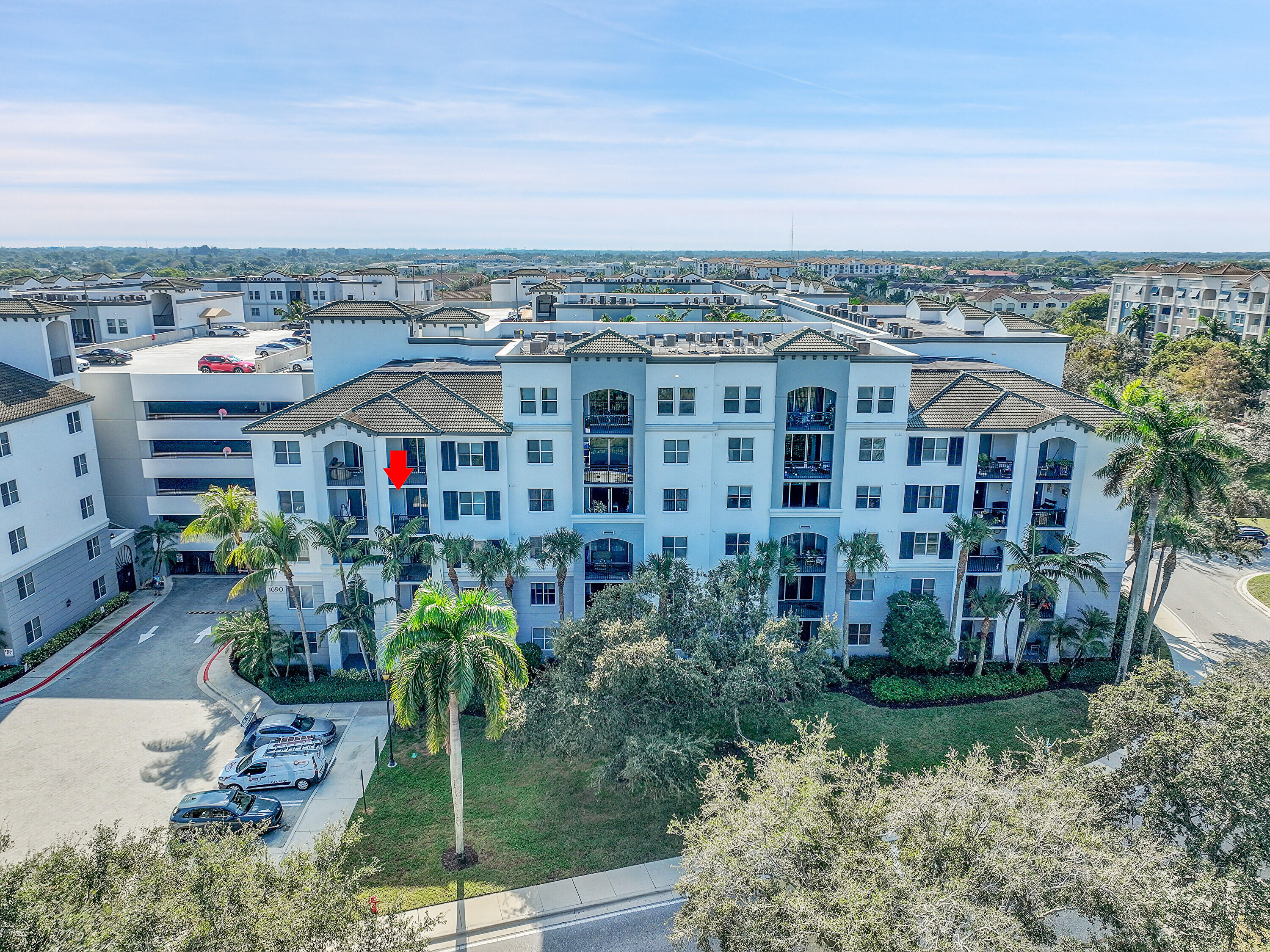 1690 Renaissance Commons Boulevard, Unit 1401 Boynton Beach, FL 33426 - Photo 1 of 41 a view of a city and tall buildings
