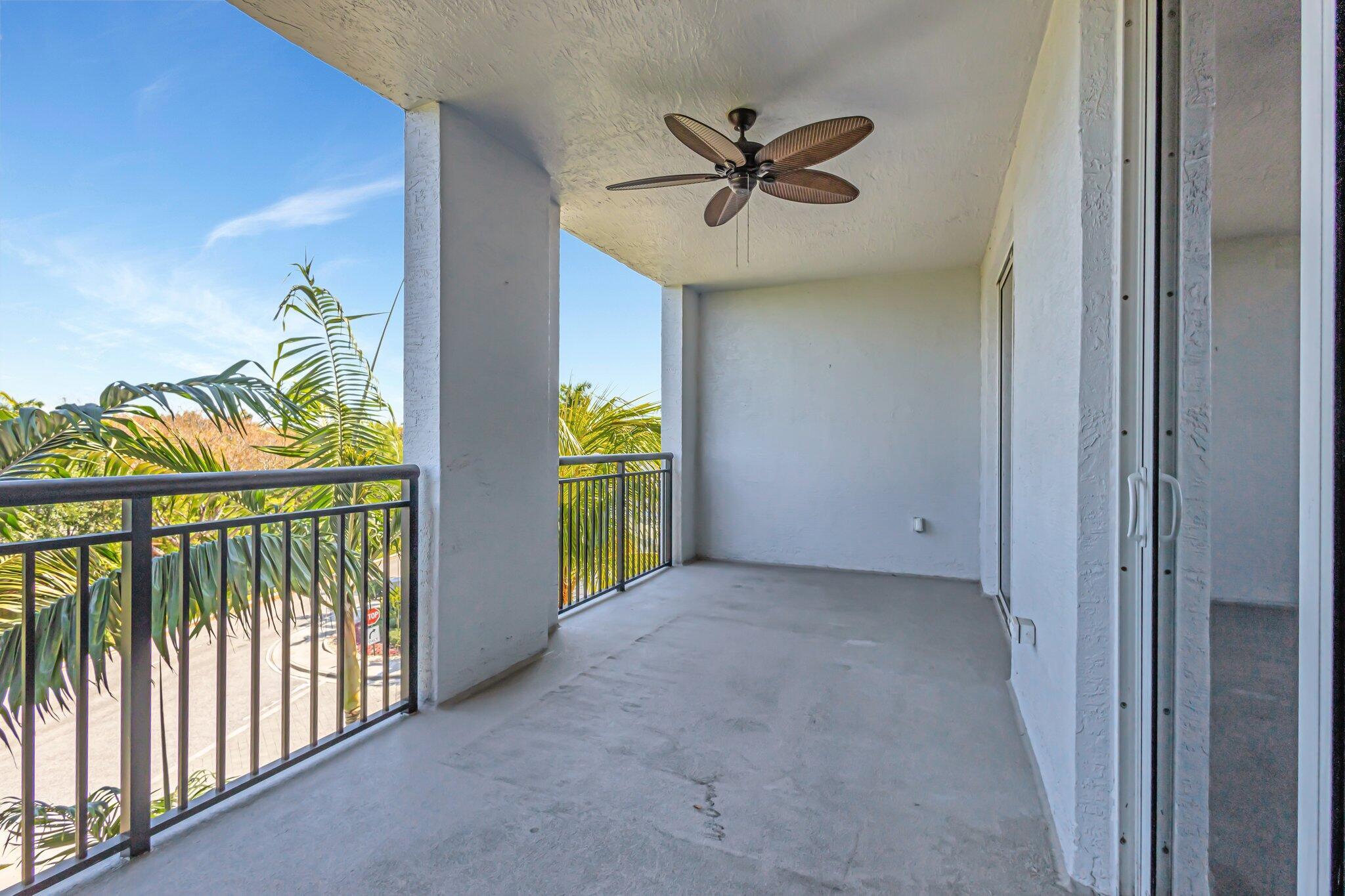 1690 Renaissance Commons Boulevard, Unit 1401 Boynton Beach, FL 33426 - Photo 14 of 41 a view of a hallway with a yellow space