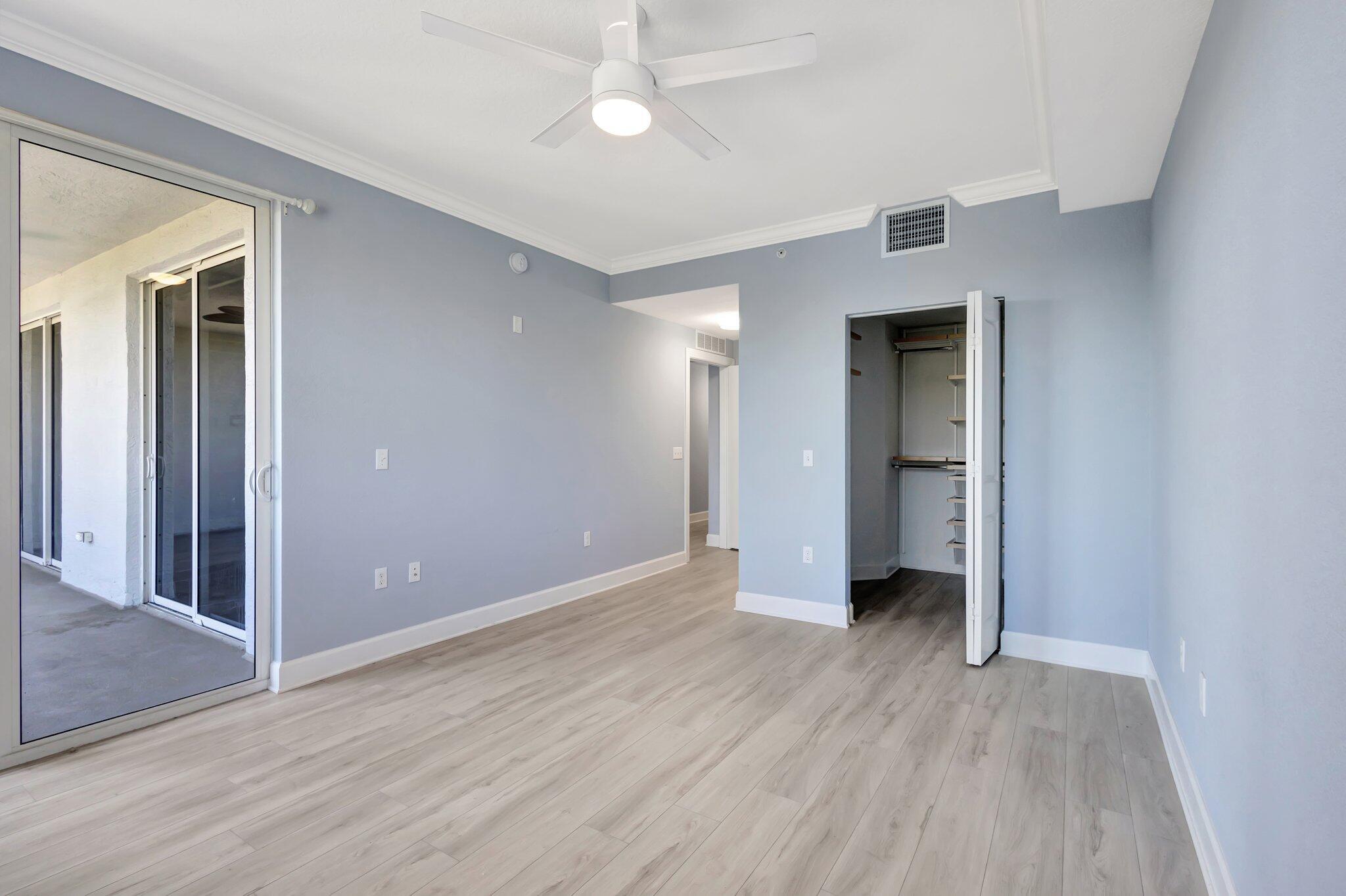 1690 Renaissance Commons Boulevard, Unit 1401 Boynton Beach, FL 33426 - Photo 18 of 41 wooden floor in an empty room with a window