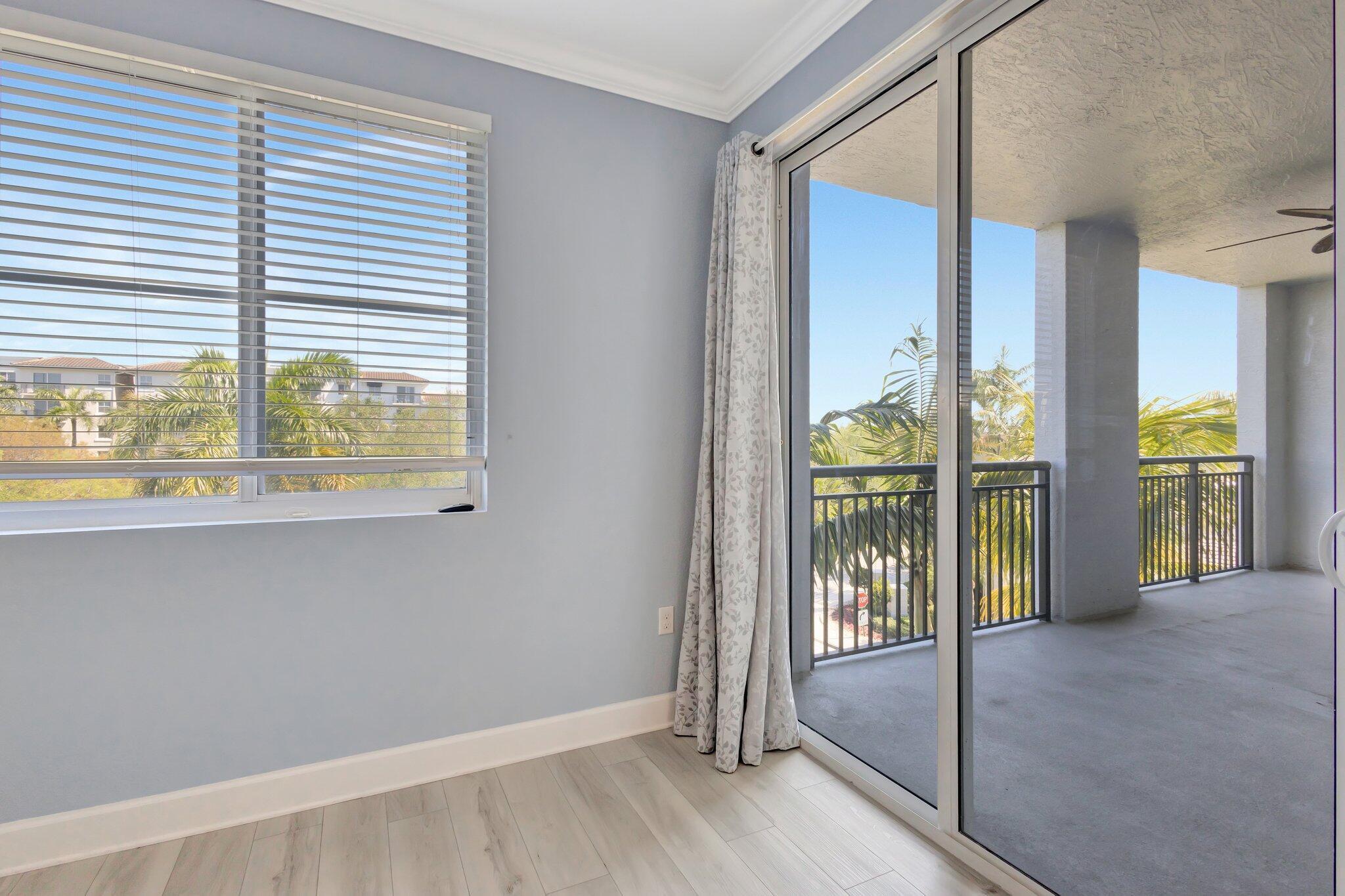 1690 Renaissance Commons Boulevard, Unit 1401 Boynton Beach, FL 33426 - Photo 19 of 41 an empty room with windows