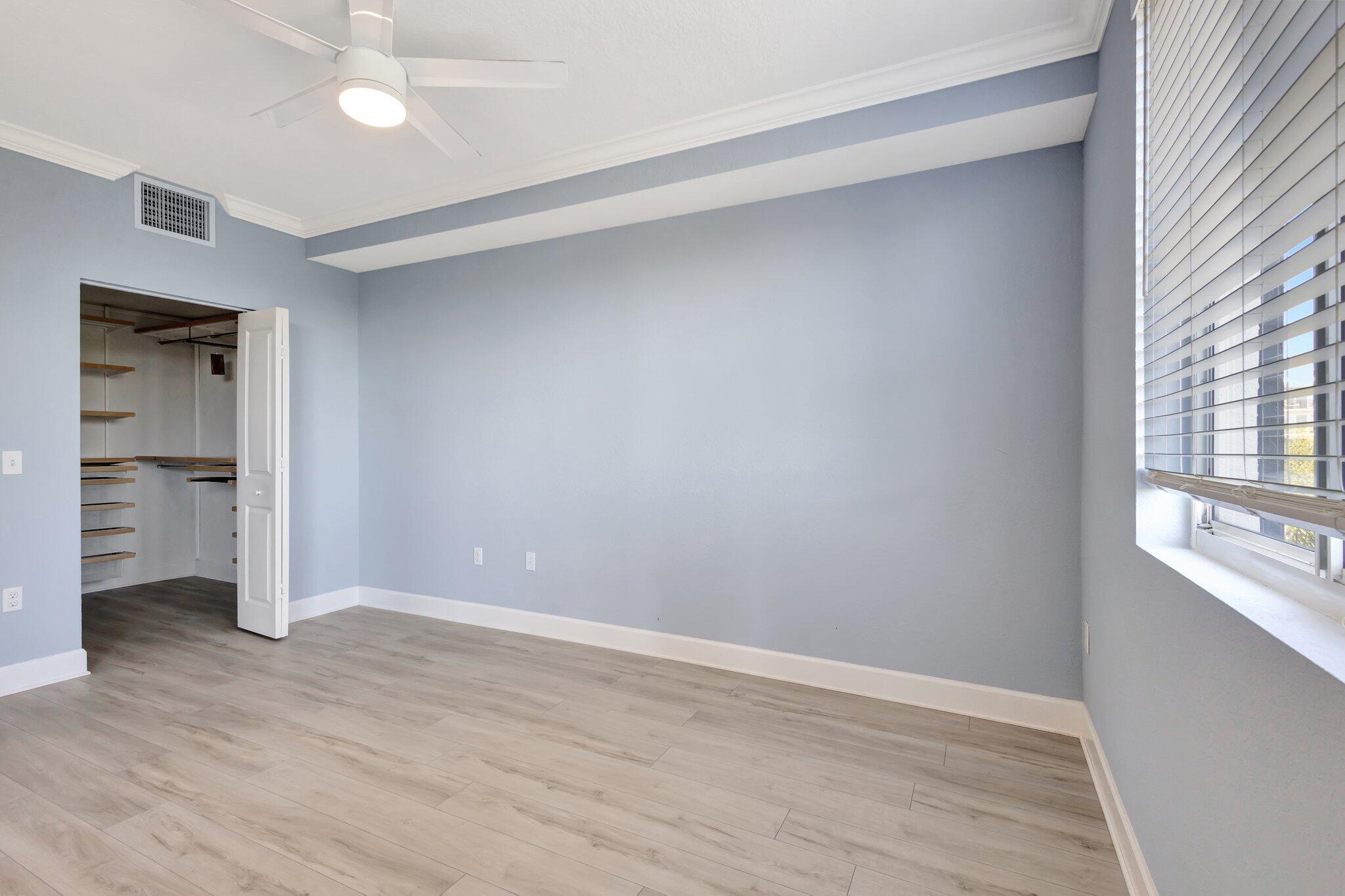 1690 Renaissance Commons Boulevard, Unit 1401 Boynton Beach, FL 33426 - Photo 20 of 41 wooden floor in an empty room with a window