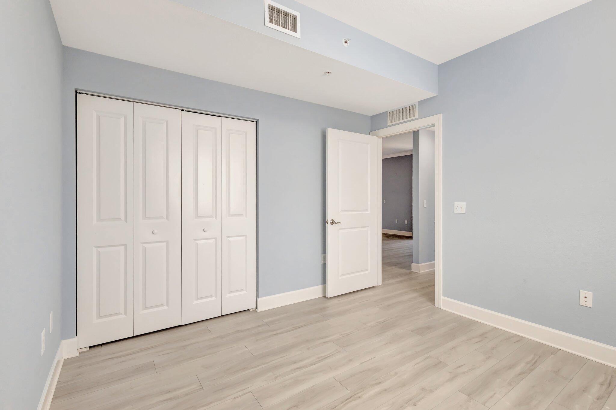 1690 Renaissance Commons Boulevard, Unit 1401 Boynton Beach, FL 33426 - Photo 28 of 41 wooden floor in an empty room