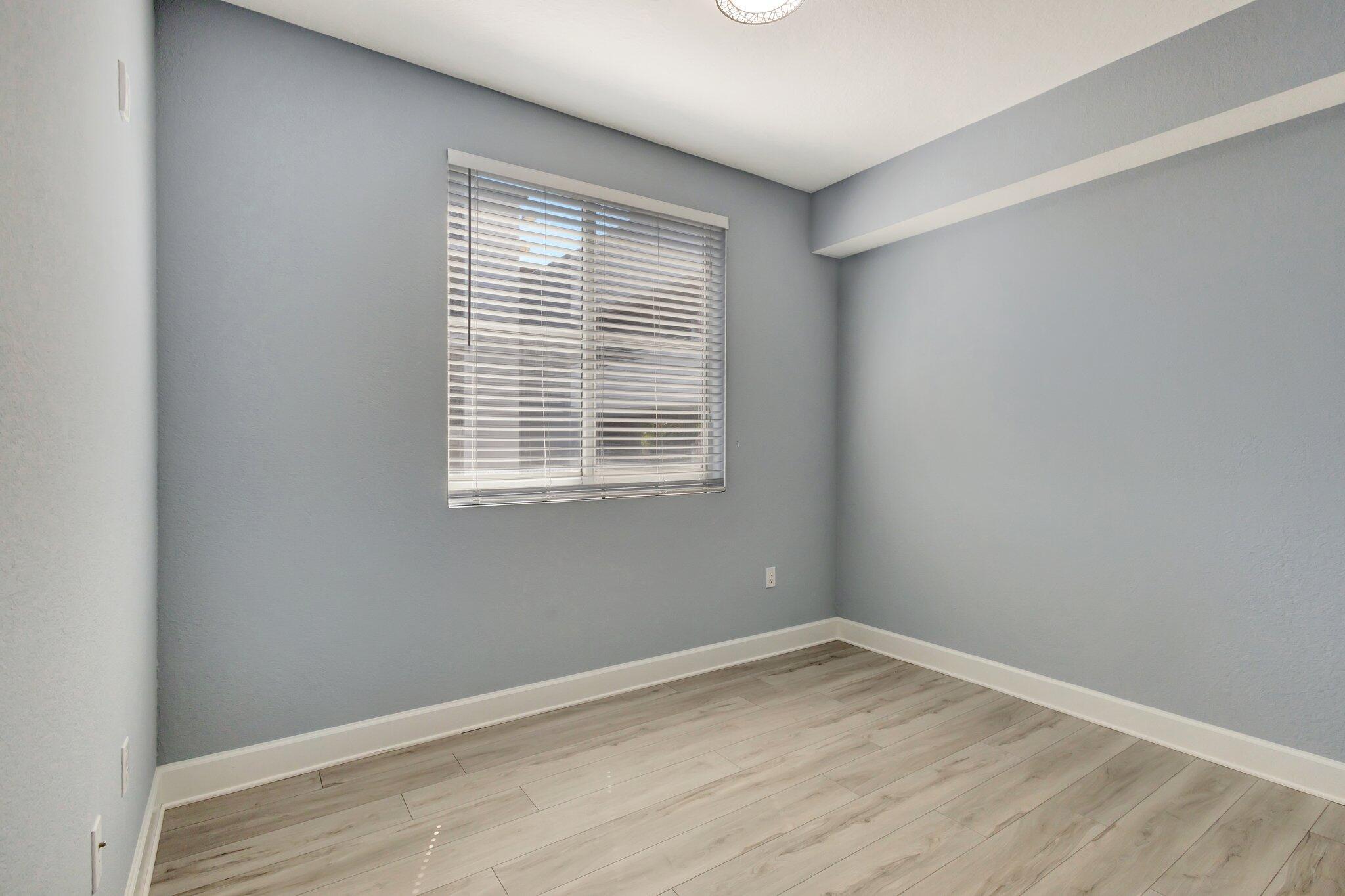 1690 Renaissance Commons Boulevard, Unit 1401 Boynton Beach, FL 33426 - Photo 30 of 41 an empty room with a window