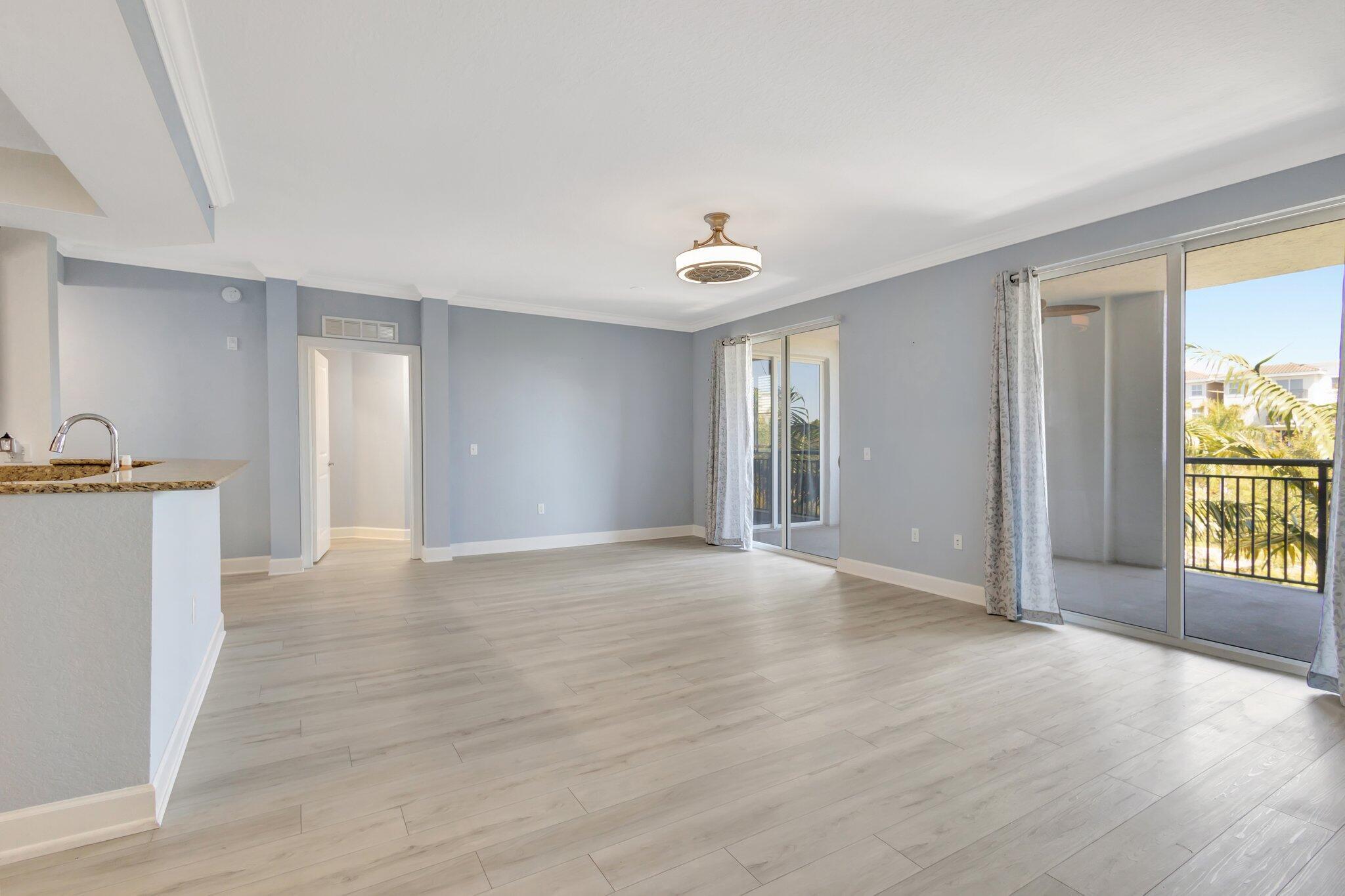 1690 Renaissance Commons Boulevard, Unit 1401 Boynton Beach, FL 33426 - Photo 31 of 41 a view of an empty room with a window