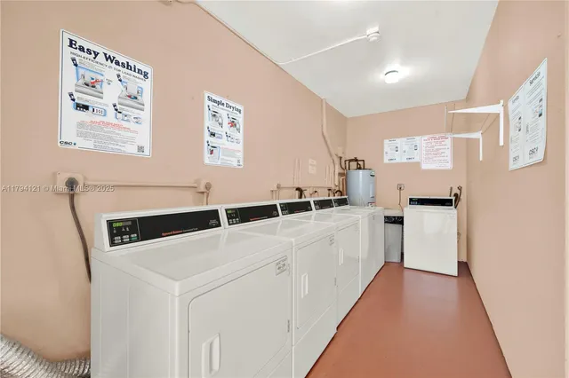 a kitchen with a white cabinets and white appliances