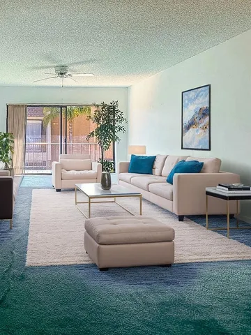 a living room with furniture and a large window