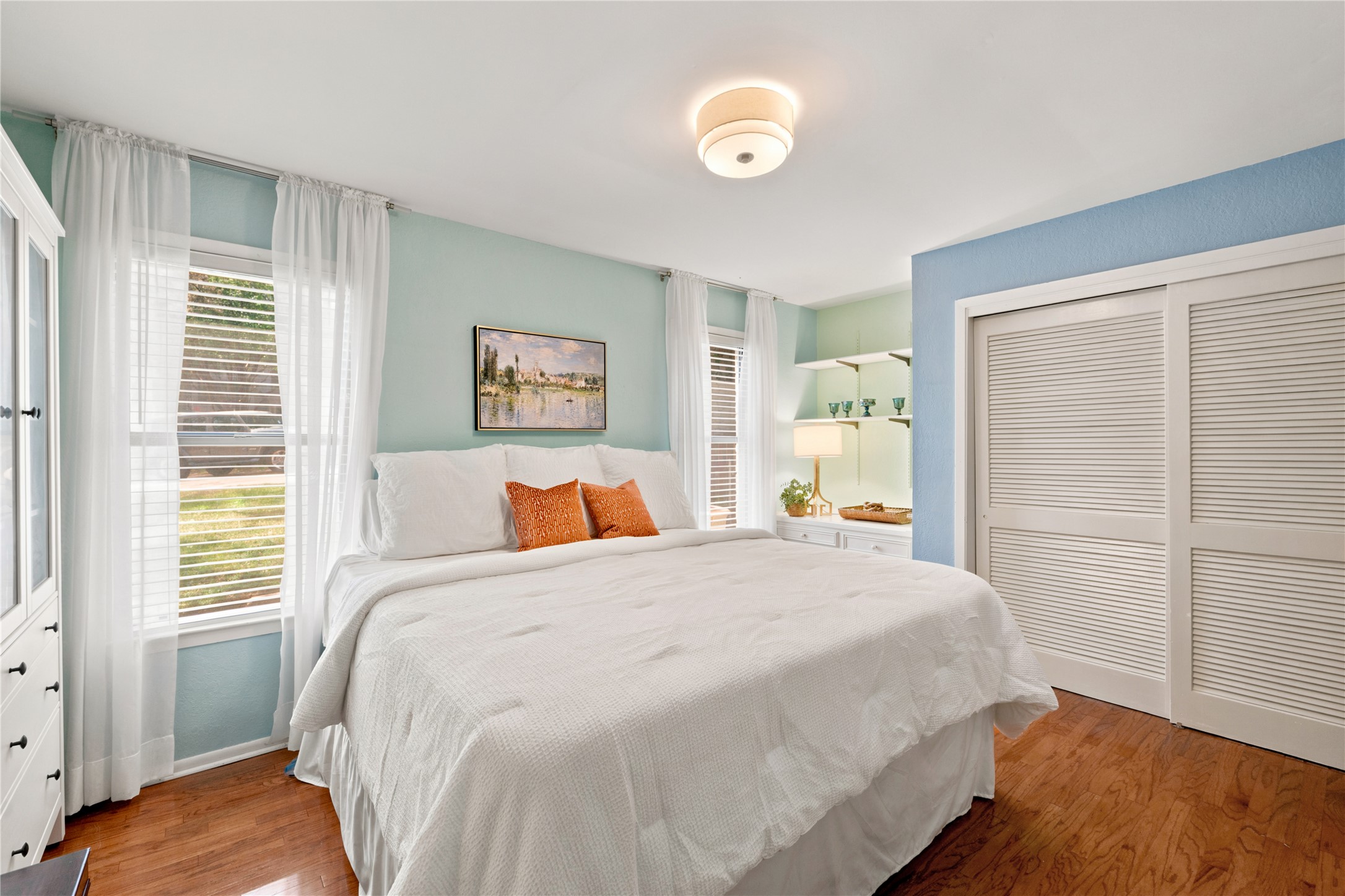 1904 Stoneridge Road Austin, TX 78746 - Photo 25 of 40 Another view of the secondary bedroom showcases the generous closet space and cheerful natural light.