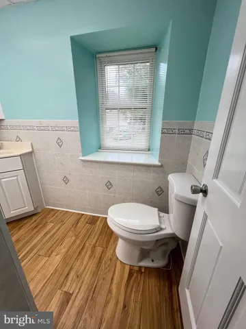 a bathroom with a toilet and a sink