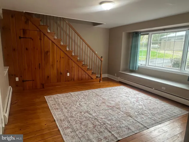a view of entryway with wooden floor