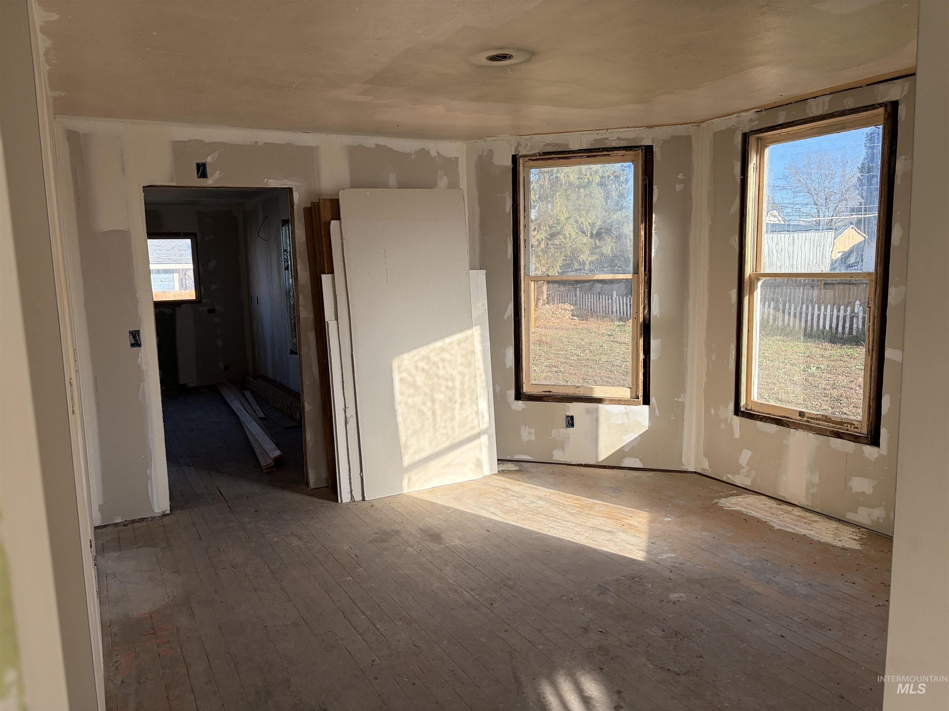 308 East Park Street Weiser, ID 83672 - Photo 16 of 50 Empty room with hardwood / wood-style flooring and plenty of natural light