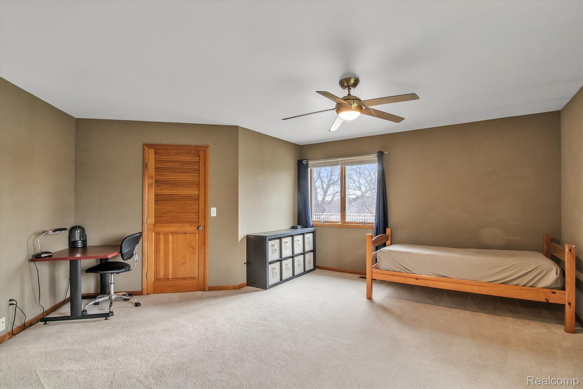 4211 Crandall Road Howell, MI 48855 - Photo 25 of 42 Upstairs Bedroom with View of the Patio