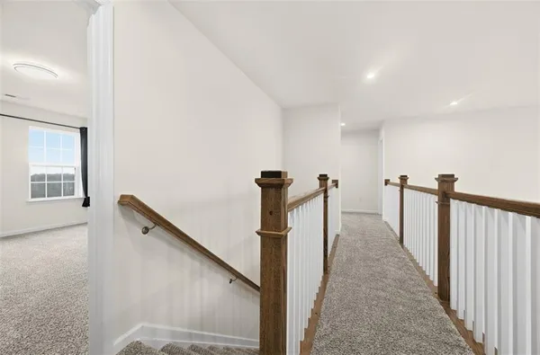a view of a hallway with windows
