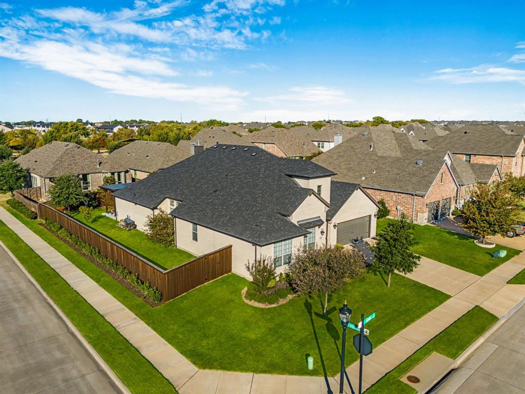 4433 Ginger Road Prosper, TX 75078 - Photo 1 of 1 an aerial view of residential houses with outdoor space and trees
