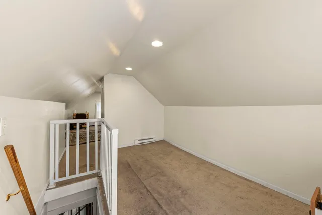 a view of an empty room with stairs