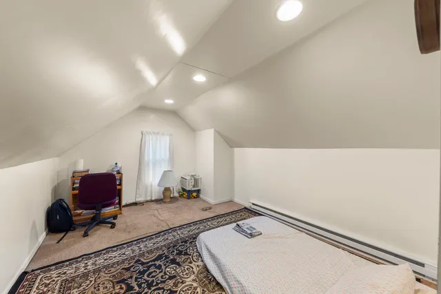 a room with a couch and a rug