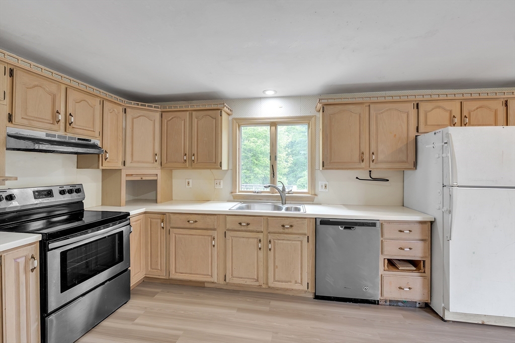 45 Alpine Drive Southbridge, MA 01550 - Photo 3 of 35 a kitchen with a sink stove and refrigerator