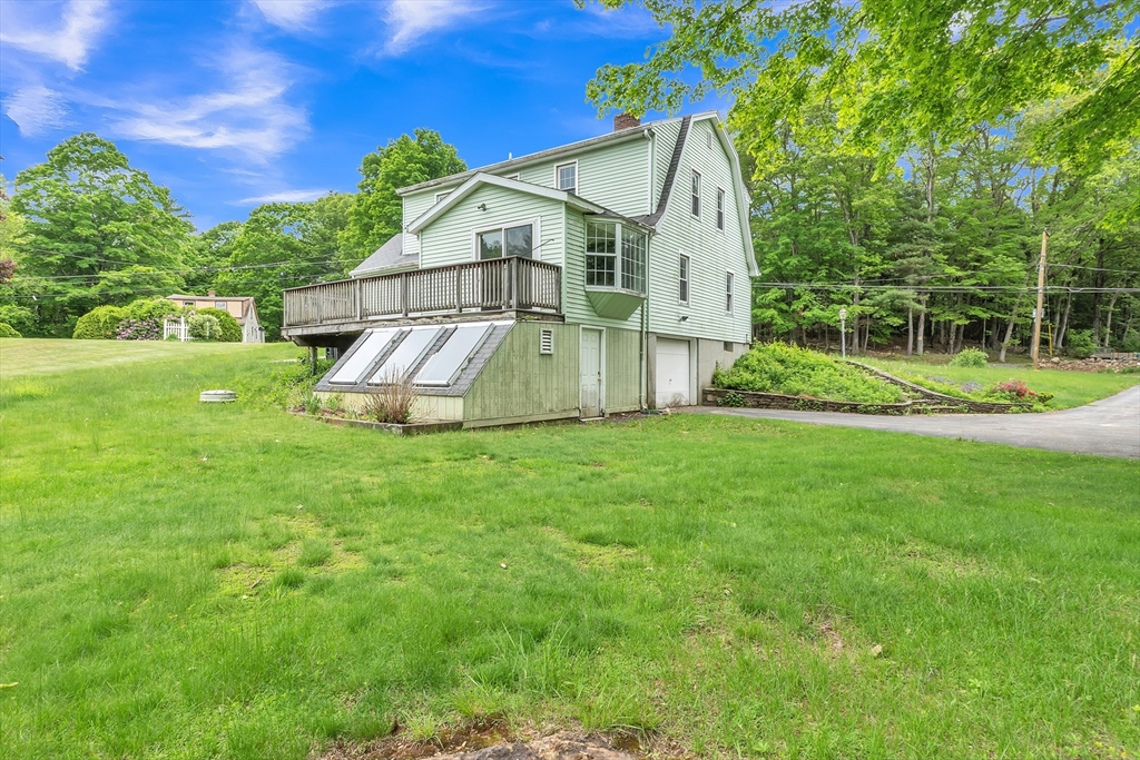 45 Alpine Drive Southbridge, MA 01550 - Photo 31 of 35 a view of a house with a big yard potted plants and large tree