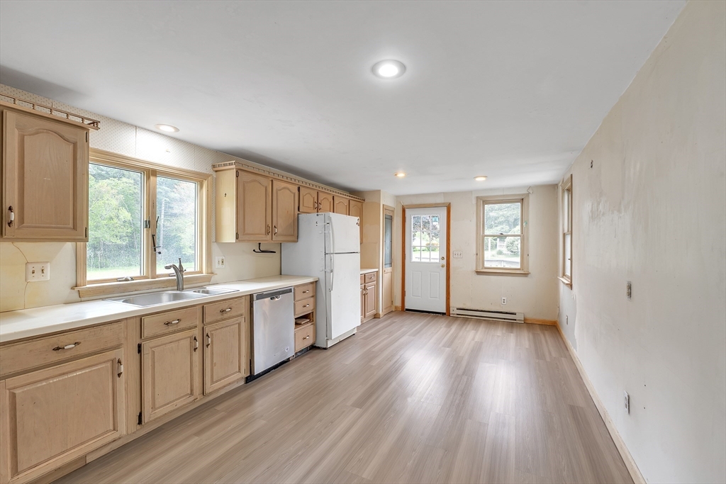 45 Alpine Drive Southbridge, MA 01550 - Photo 4 of 35 a large kitchen with a lot of window and wooden floor