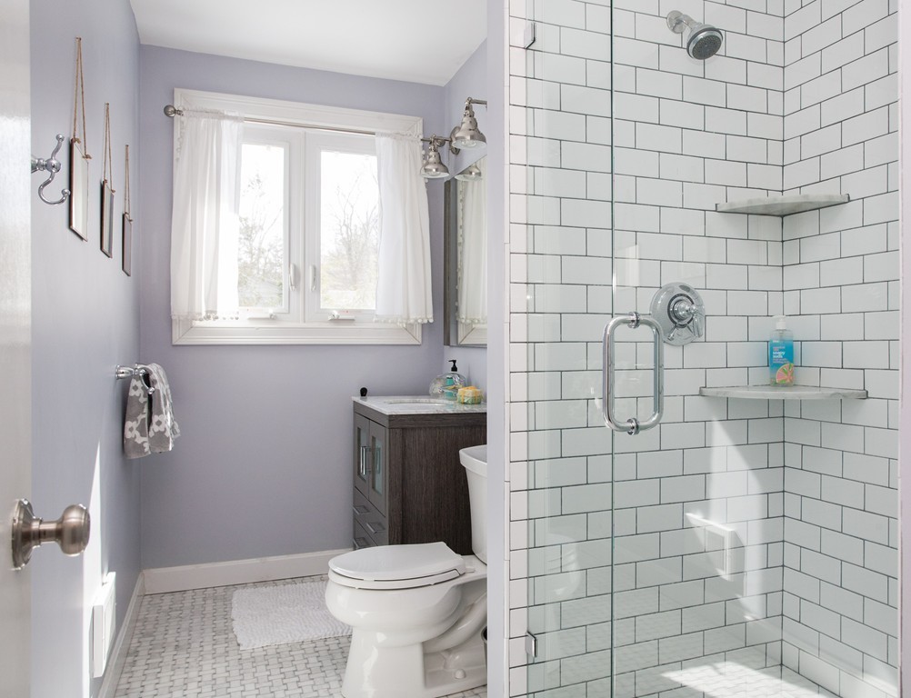 566 Newton Street Brookline, MA 02467 - Photo 14 of 30 a bathroom with a sink a toilet and shower