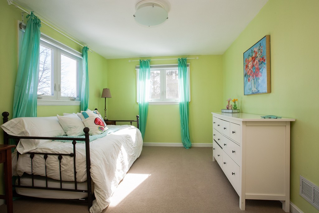 566 Newton Street Brookline, MA 02467 - Photo 17 of 30 a bedroom with a bed and a dresser