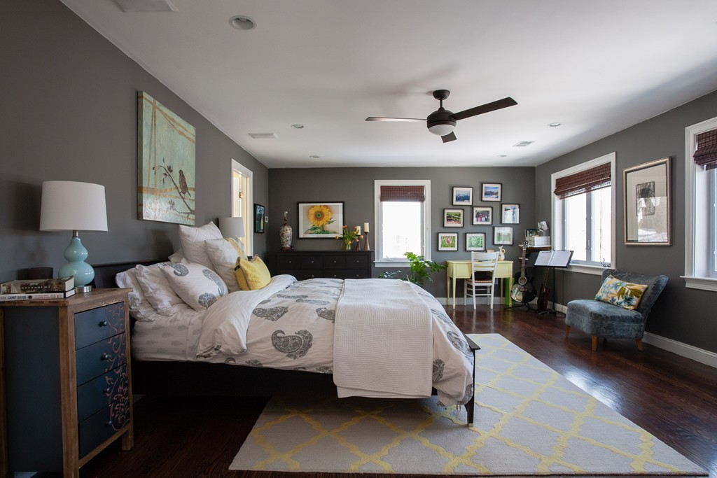 566 Newton Street Brookline, MA 02467 - Photo 20 of 30 a bedroom with a large bed couch and windows