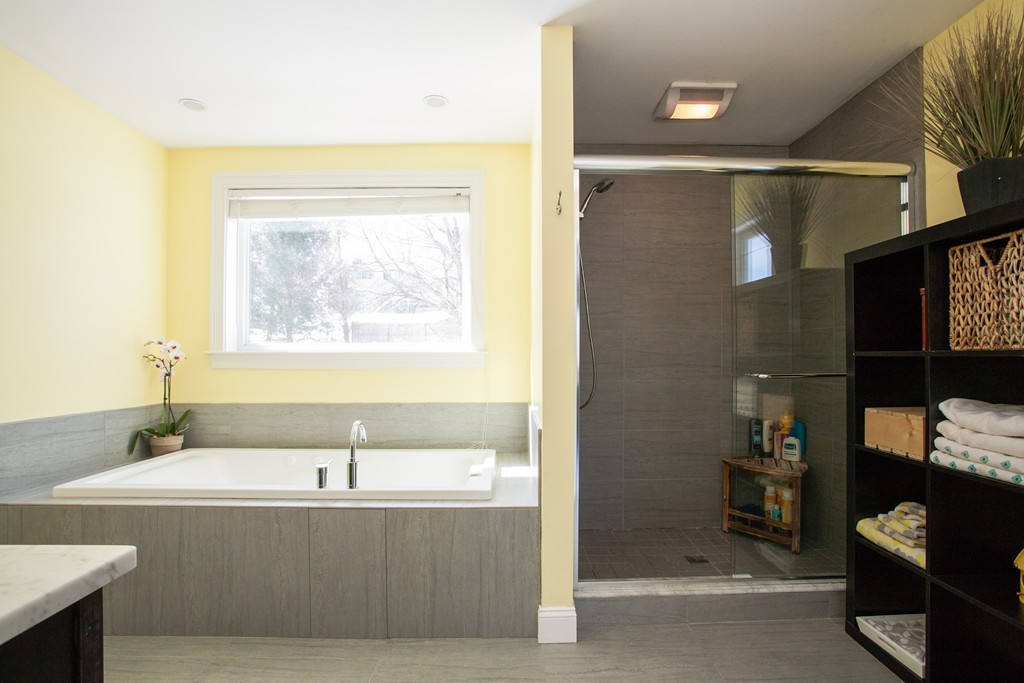 566 Newton Street Brookline, MA 02467 - Photo 22 of 30 a bathroom with a bathtub and a sink