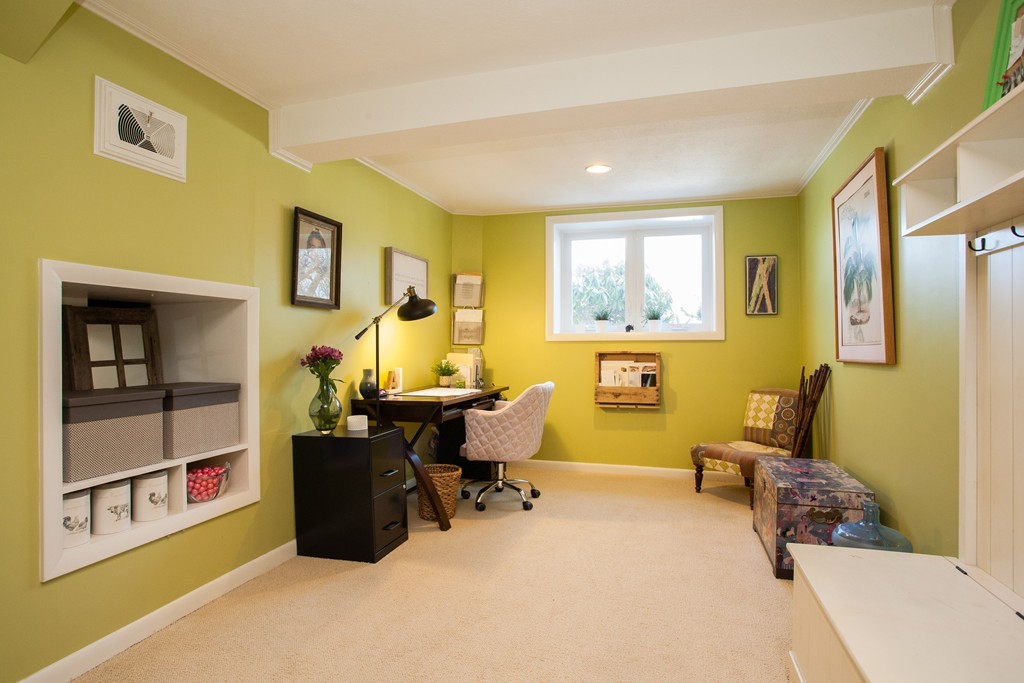 566 Newton Street Brookline, MA 02467 - Photo 24 of 30 a bedroom with a bed and wooden floor