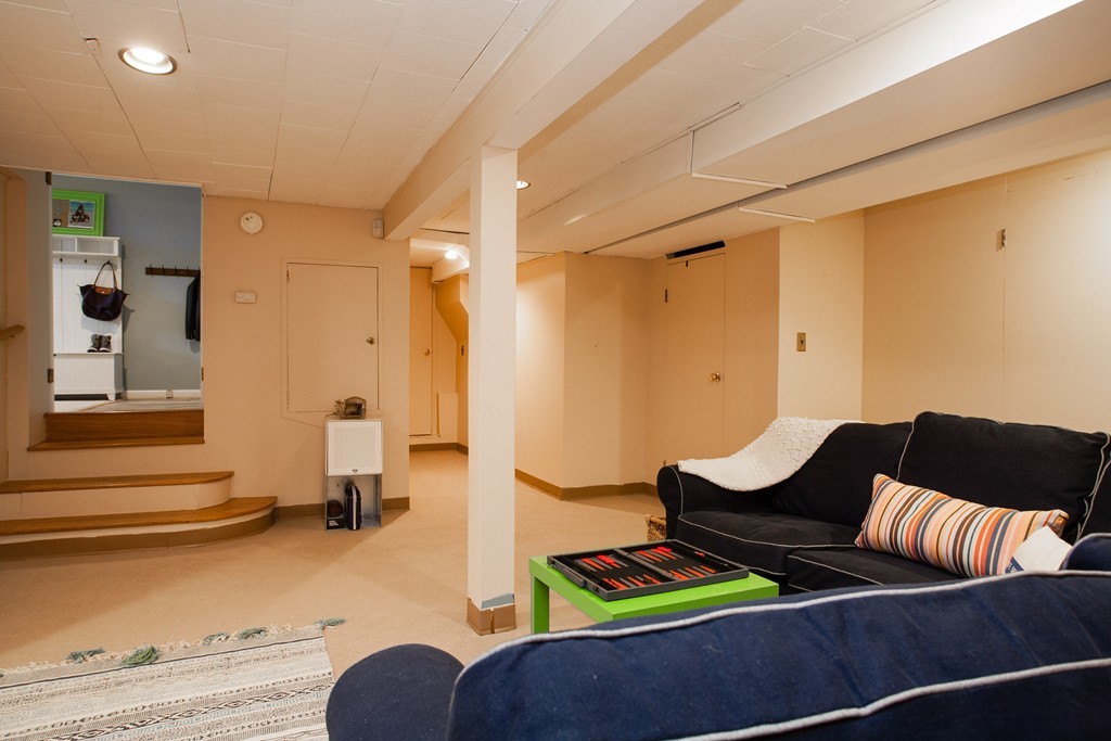 566 Newton Street Brookline, MA 02467 - Photo 28 of 30 a living room with furniture and a wooden floor