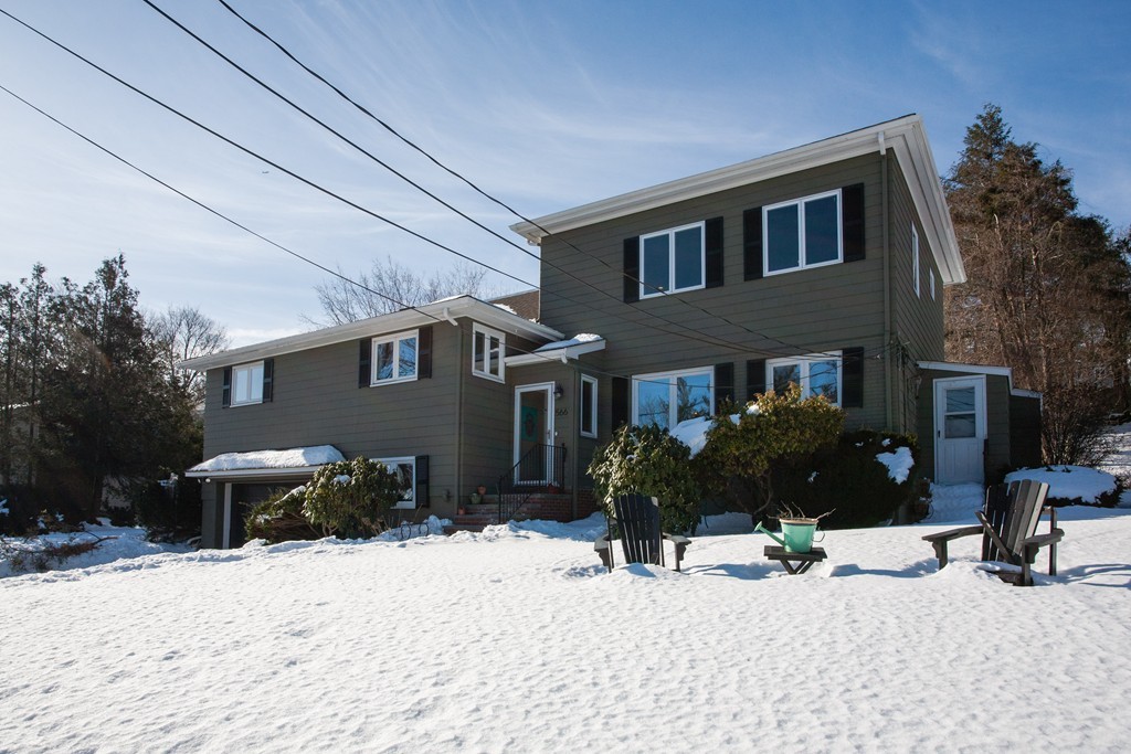 566 Newton Street Brookline, MA 02467 - Photo 30 of 30 a front view of a house with a yard covered in snow