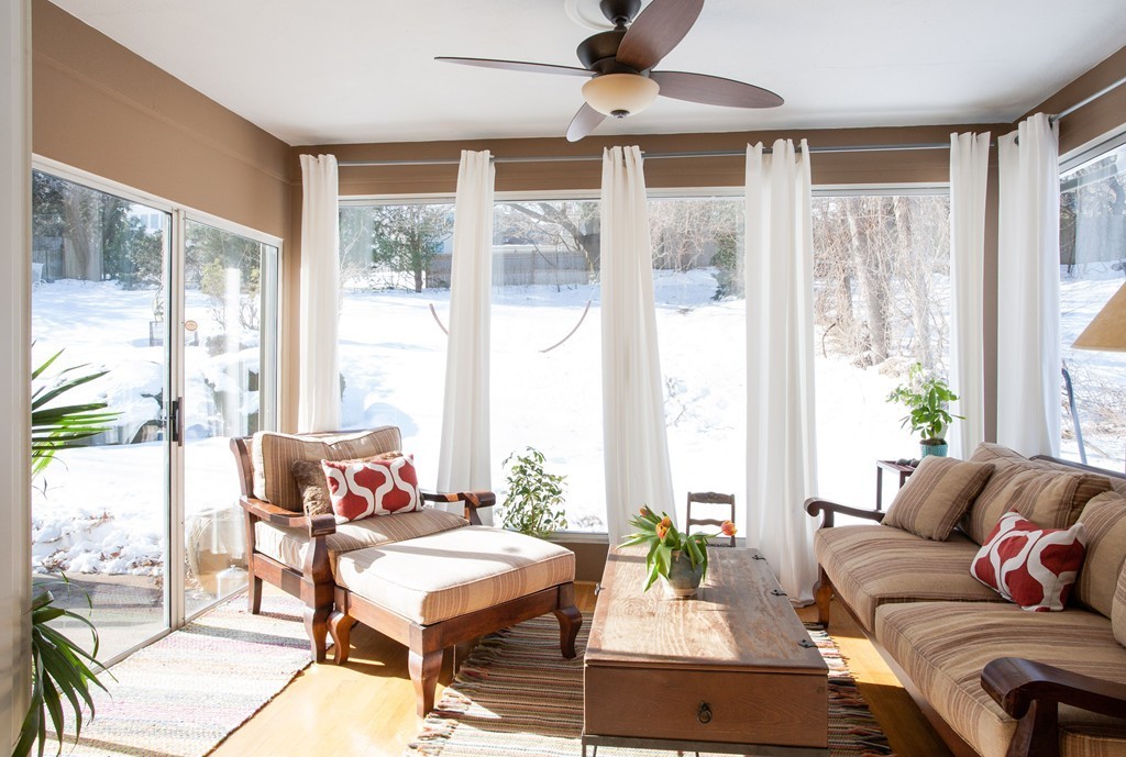 566 Newton Street Brookline, MA 02467 - Photo 7 of 30 a living room with furniture and a large window