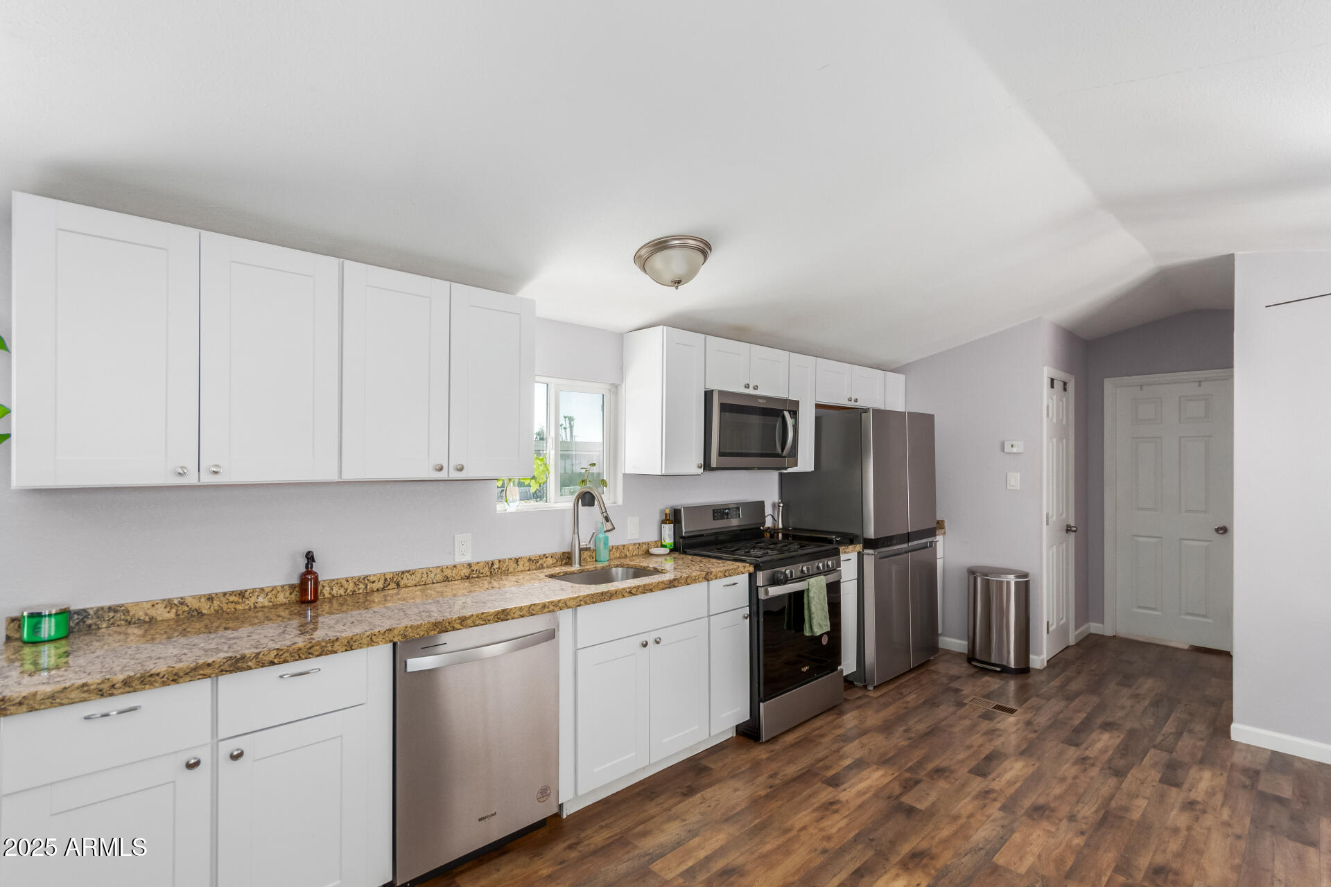 320 East McKellips Road, Unit 188 Mesa, AZ 85201 - Photo 14 of 28 a kitchen with a sink stove and refrigerator