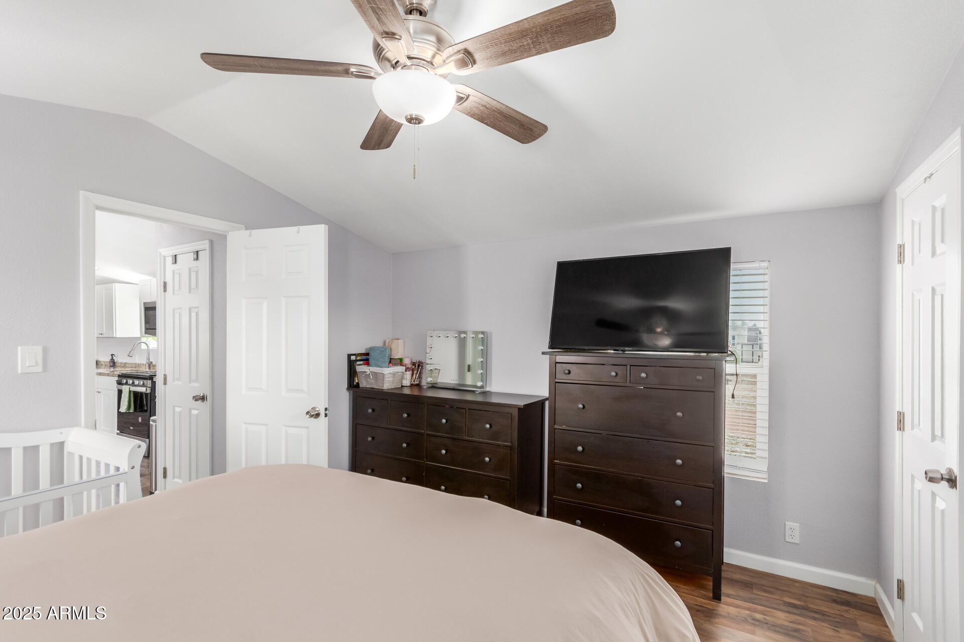 320 East McKellips Road, Unit 188 Mesa, AZ 85201 - Photo 16 of 28 a bedroom with a bed and a flat screen tv