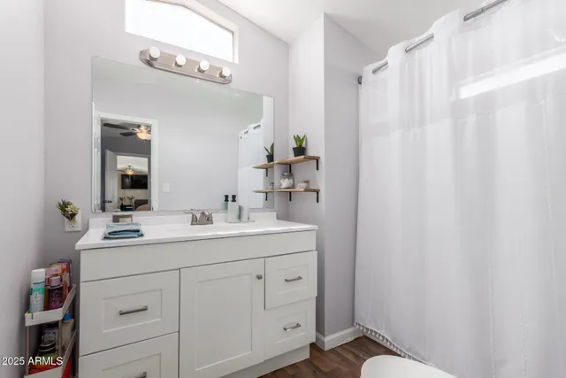 a bathroom with a double vanity sink mirror and