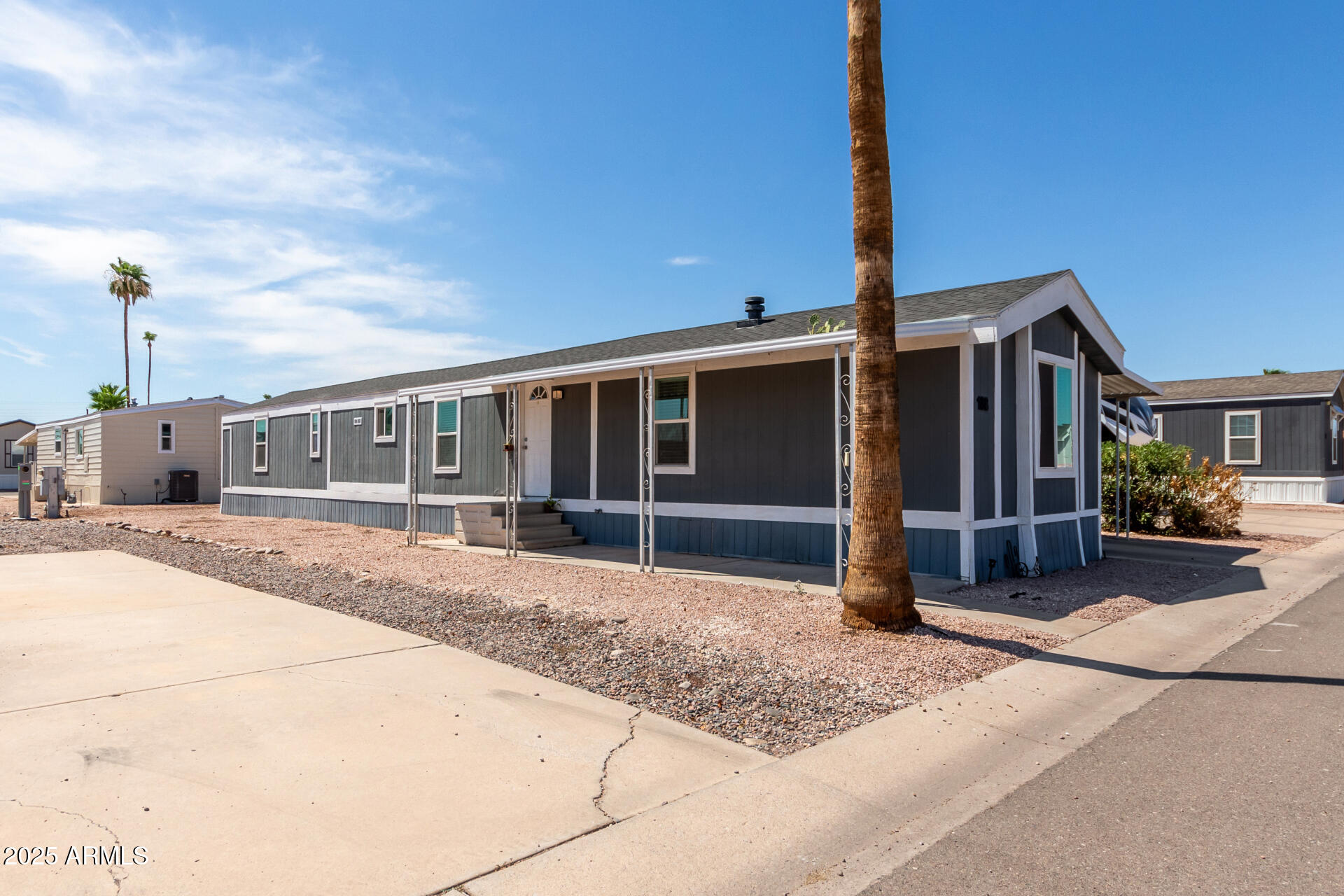 320 East McKellips Road, Unit 188 Mesa, AZ 85201 - Photo 4 of 28 a view of a house with a patio