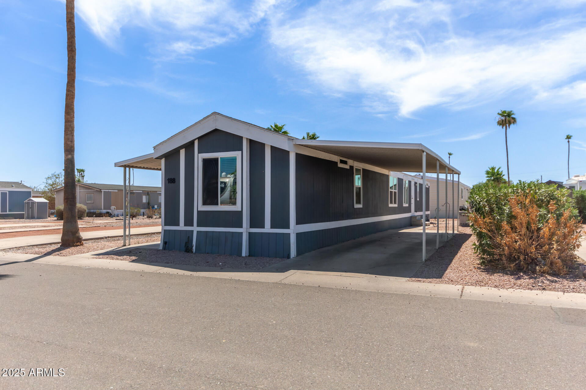 320 East McKellips Road, Unit 188 Mesa, AZ 85201 - Photo 5 of 28 a view of a house with a balcony