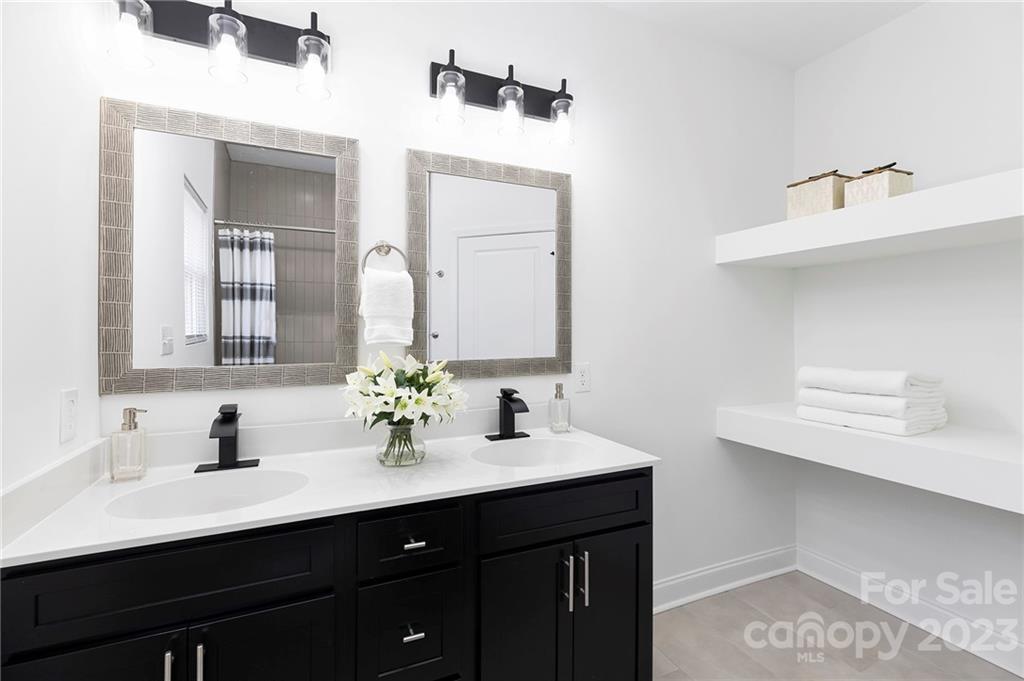 20 Rose Street York, SC 29745 - Photo 12 of 22 a bathroom with 2 sink and a mirror