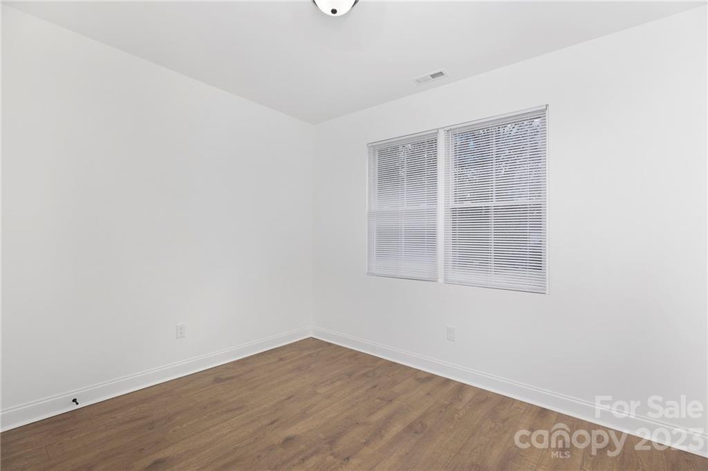 20 Rose Street York, SC 29745 - Photo 16 of 22 an empty room with wooden floor and windows