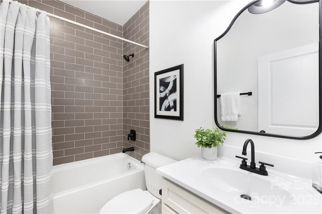 20 Rose Street York, SC 29745 - Photo 17 of 22 a bathroom with a bathtub shower sink and toilet