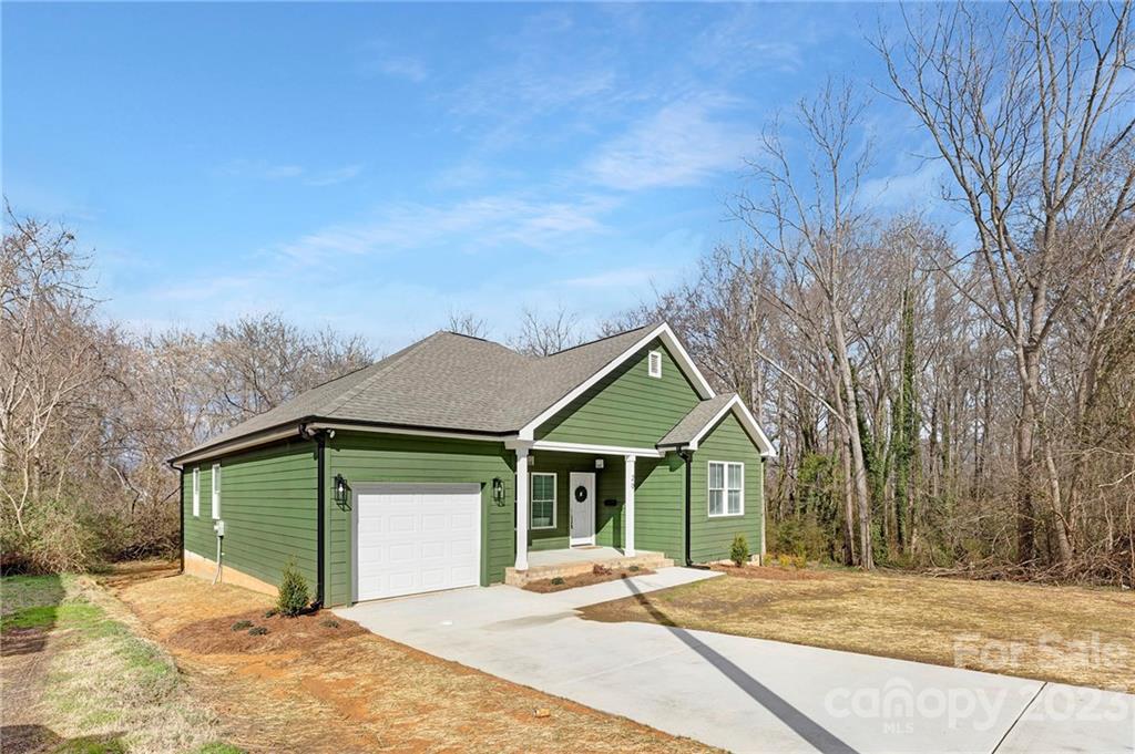 20 Rose Street York, SC 29745 - Photo 19 of 22 a front view of a house with a yard and garage