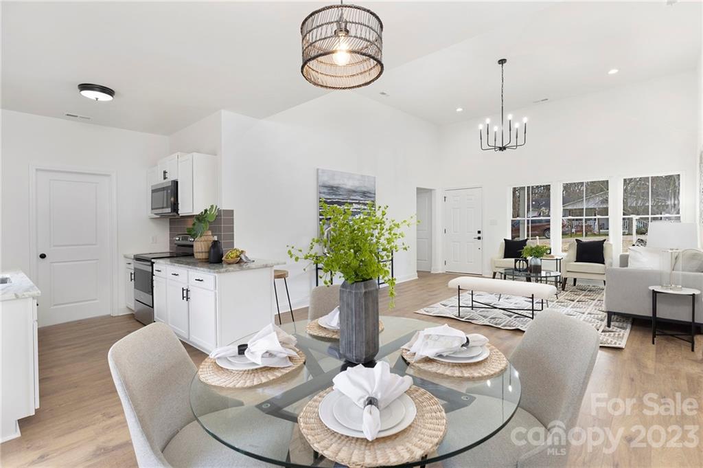 20 Rose Street York, SC 29745 - Photo 5 of 22 a dining room with furniture a rug and wooden floor