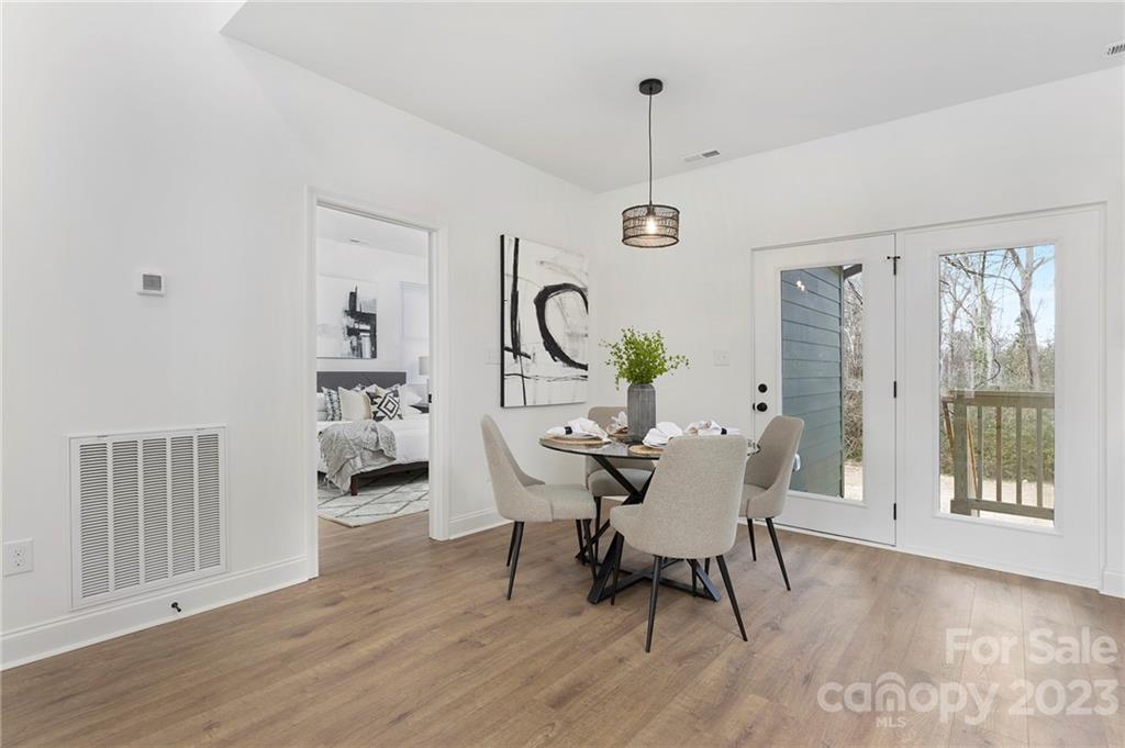 20 Rose Street York, SC 29745 - Photo 9 of 22 a view of a dining room with furniture window and wooden floor