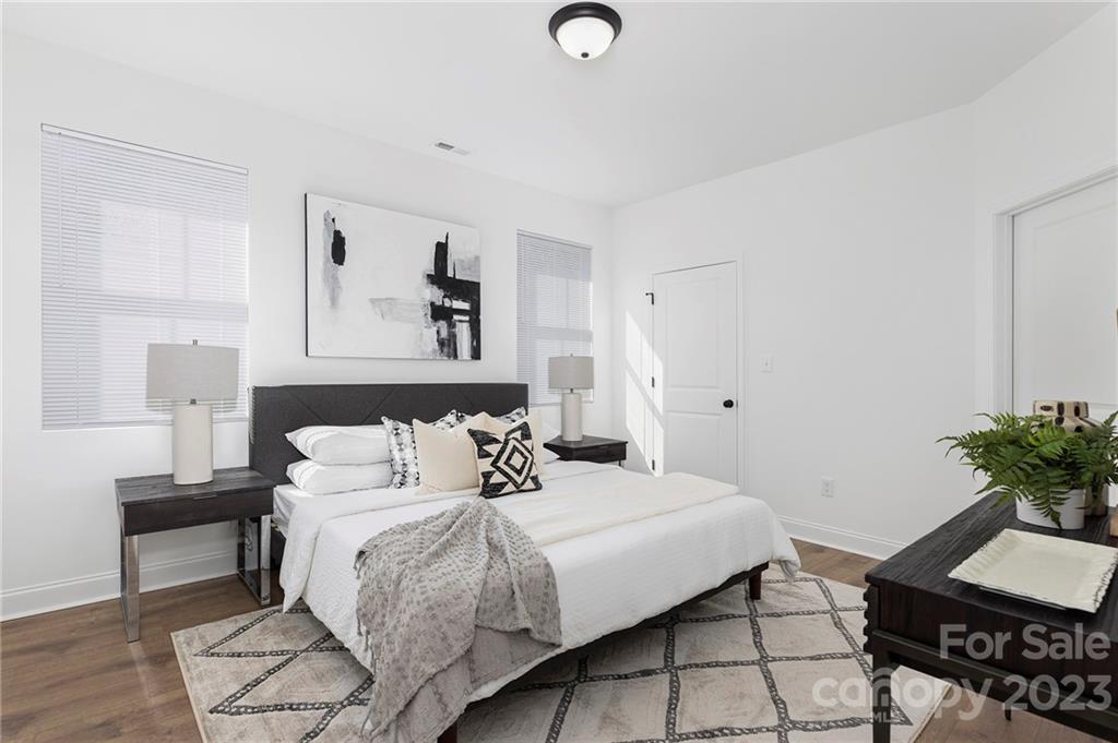20 Rose Street York, SC 29745 - Photo 10 of 22 a bedroom with a bed and a potted plant on the dresser