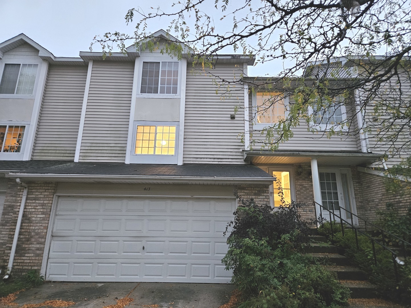 a front view of a house with yellow lighting