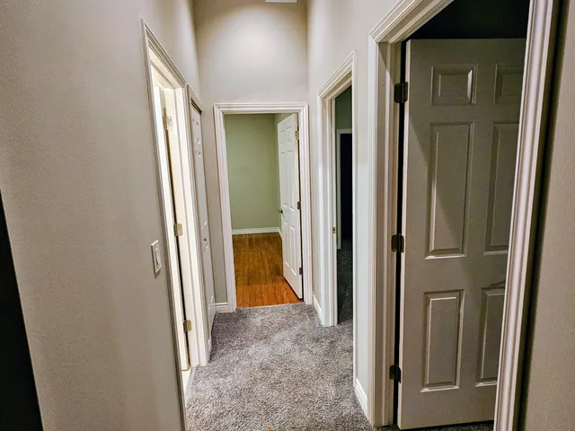 a view of a bathroom from a corridor