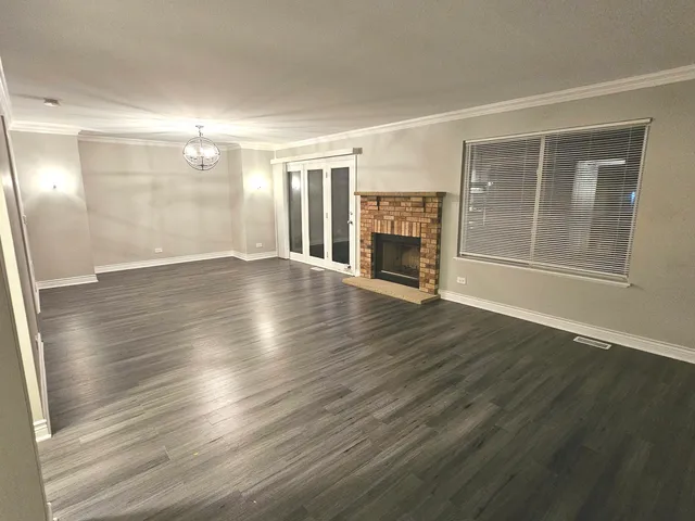 a view of a livingroom with wooden floor