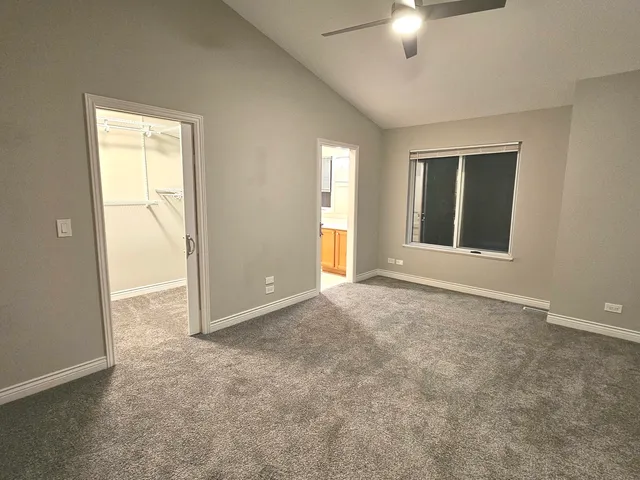 an empty room with a empty space and a window